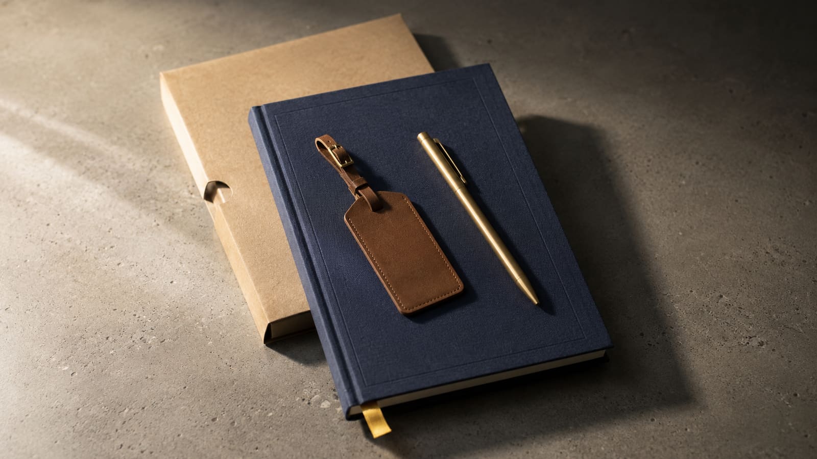A curated flat-lay of premium conference giveaways including a quality notebook, branded water bottle, and cable organizer on a dark linen surface